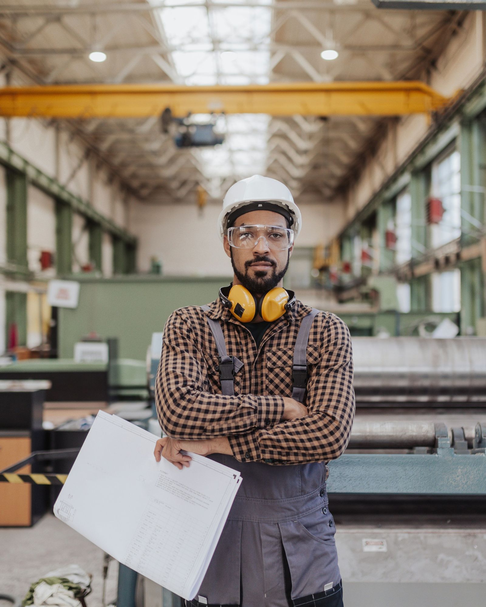 Industrial engineer reviewing technical plans