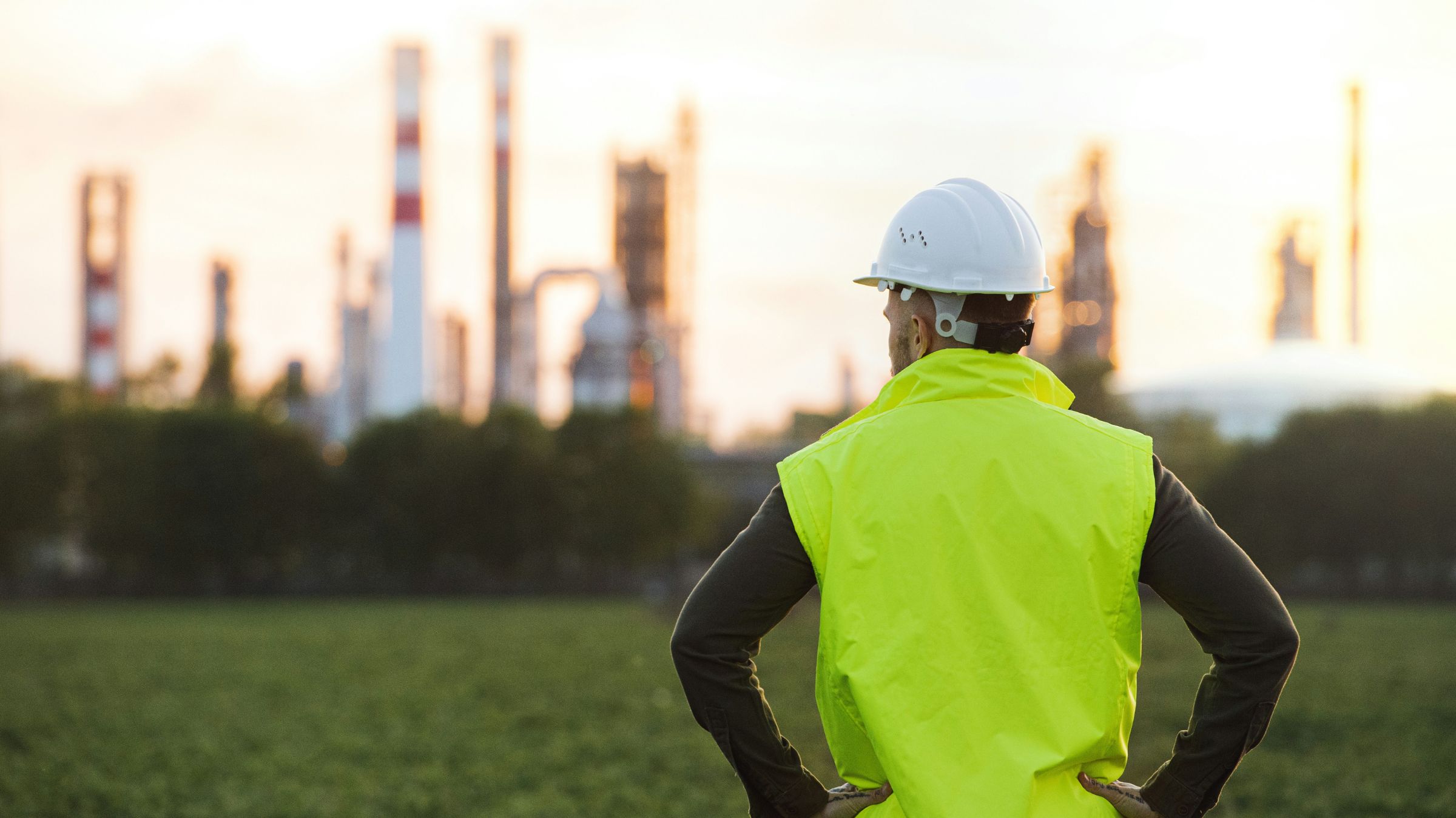 Engineer overlooking an oil and gas refinery